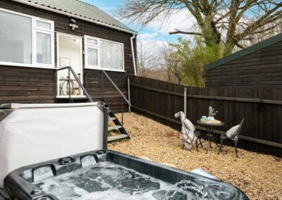 Dreamwood, a luxury, dog-friendly holiday chalet with a hot tub, sleeps two | Downwood Holidays, Dorset